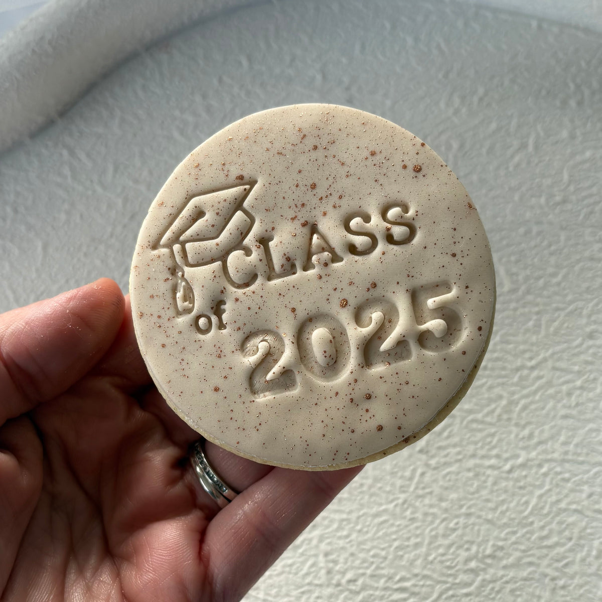 Graduation cookies from My Little Bake Co featuring "Class of 2025" custom celebration treats with colorful icing and decorative designs.